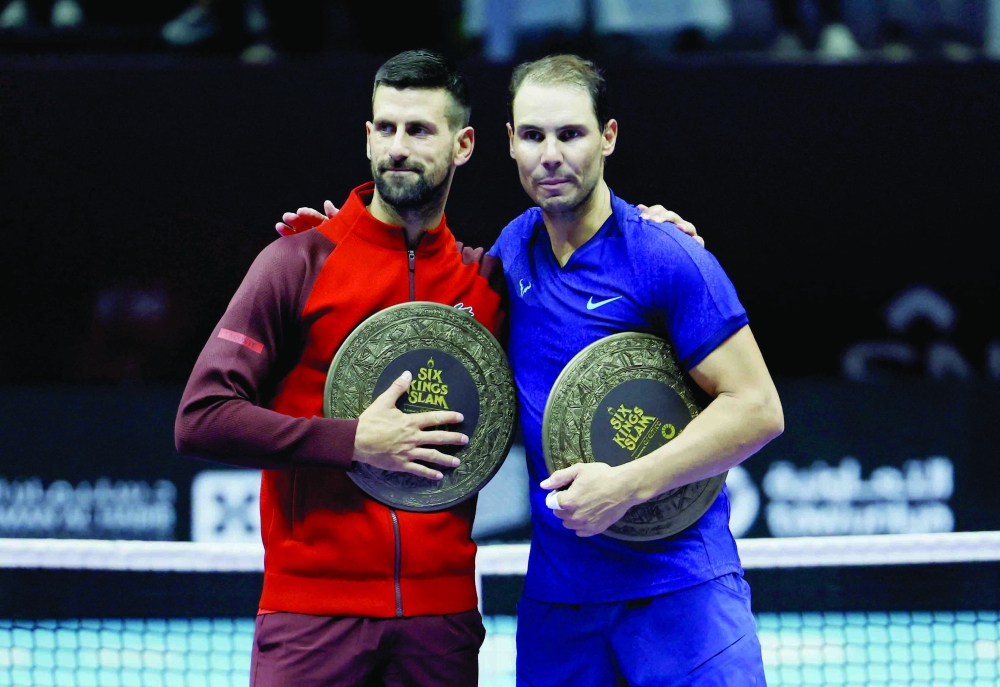 Serbia's Djokovic and Spain's Nadal pose after their third place match. — Reuters