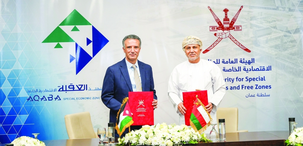 The MoU was signed between Eng Ahmed bin Hassan al Dheeb, from SEZAD, and Naif Hamidi al Fayez from Jordan