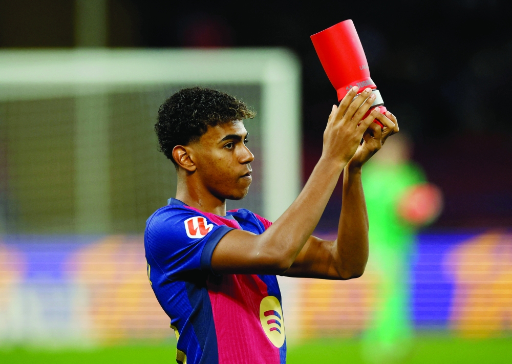 Yamal holds the LaLiga player of the month trophy. — Reuters 