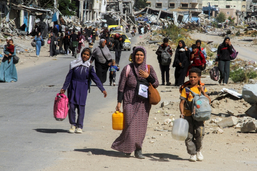 Displaced Palestinians flee amid an Israeli military operation, in Jabalia in the northern Gaza Strip. — Reuters 