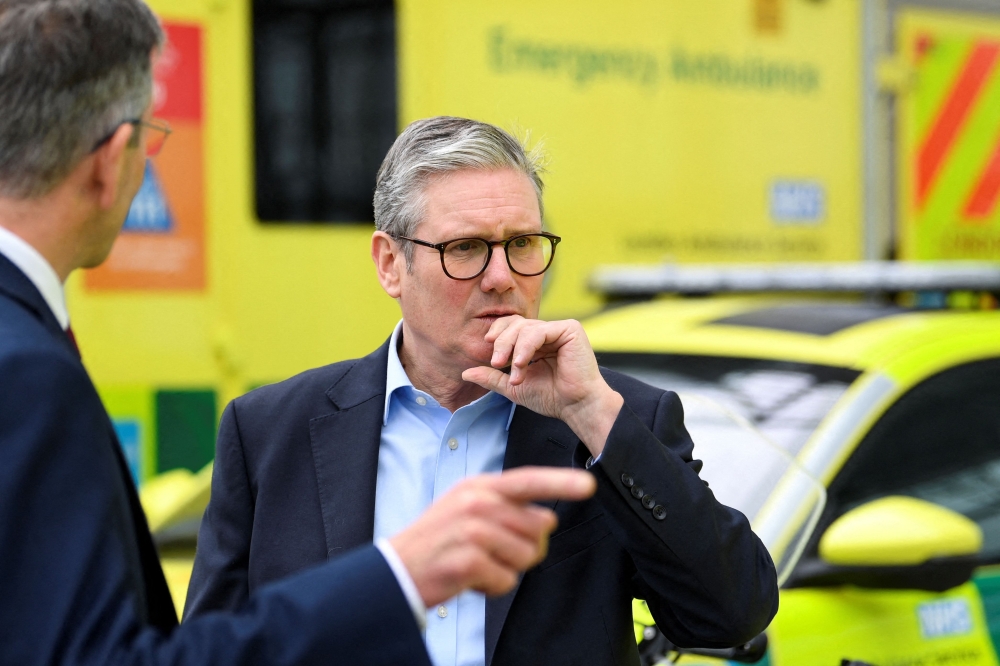 Britain's Prime Minister Keir Starmer reacts as he speaks outside of London ambulance service. — AFP file photo