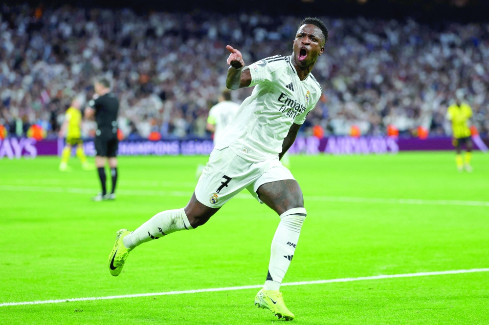 Vinicius Junior celebrates scoring their second goal during the UEFA Champions League, league phase day 3 football match between Real Madrid CF and Borussia Dortmund at the Santiago Bernabeu stadium in Madrid on October 22, 2024.