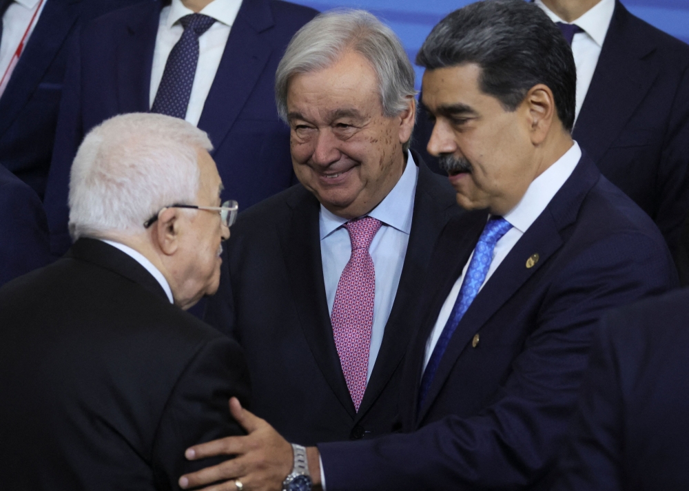 Palestinian President Mahmoud Abbas, UN Secretary General Antonio Guterres, Venezuelan President Nicolas Maduro and other participants in the outreach/BRICS Plus format meeting pose during the BRICS summit in Kazan. - AFP

