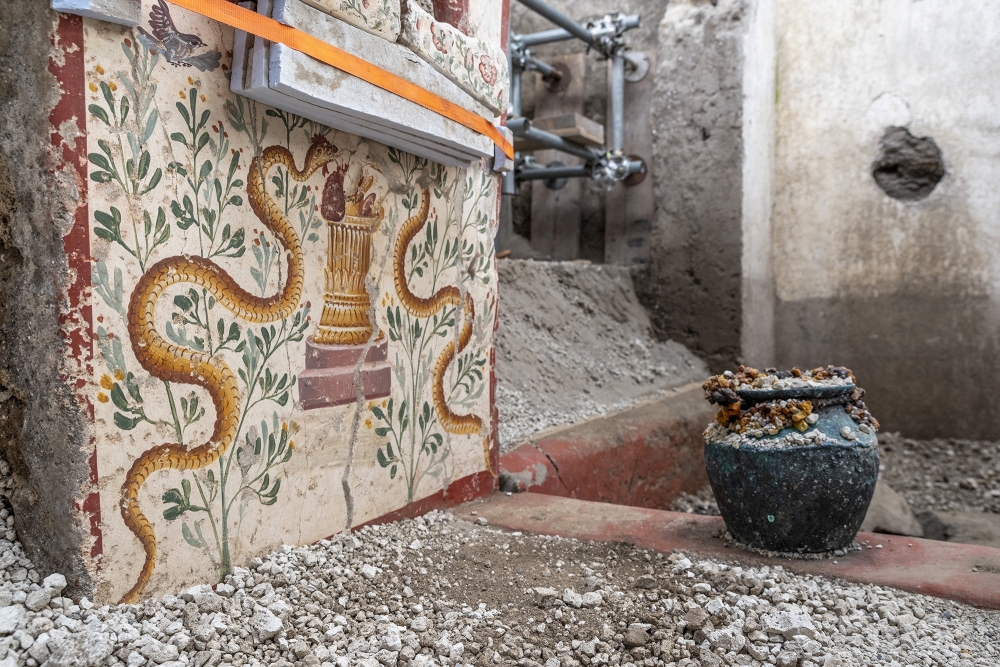 A detail of a richly decorated but uncommonly small house with finely preserved frescoes of mythological scenes is pictured in the archaeological site in Pompeii, Italy — AFP 