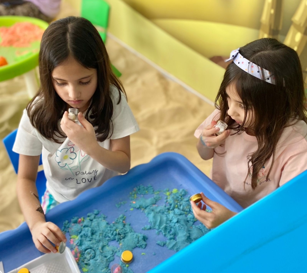 Rahma and Noor exploring olfactory skills of different scents and matching them to pictures