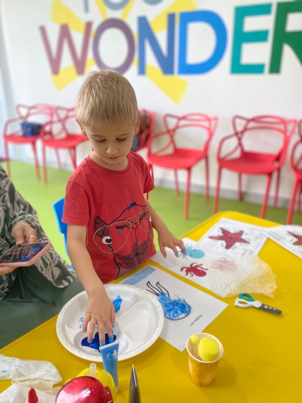 Teo exploring textured jelly fish painting