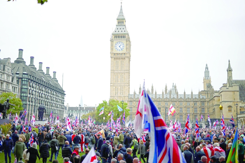 Protesters gather in Parliament Square beside the Palace of Westminster after a Uniting the Kingdom march through central London. — AFP
