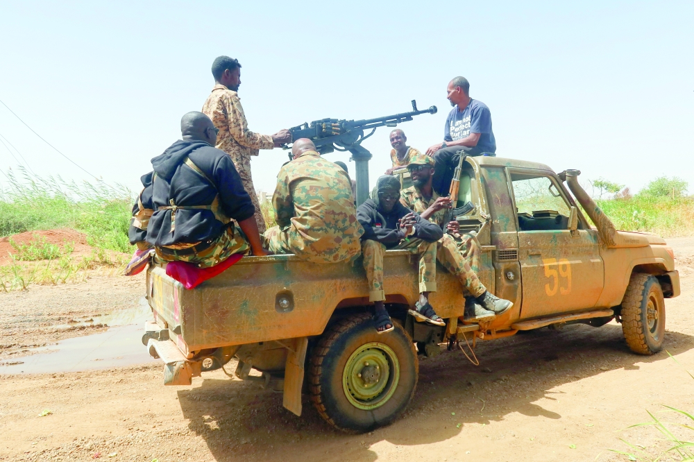 Members of Sudanese armed forces sit on an army vehicle in Omdurman, Sudan. — Reuters file photo
