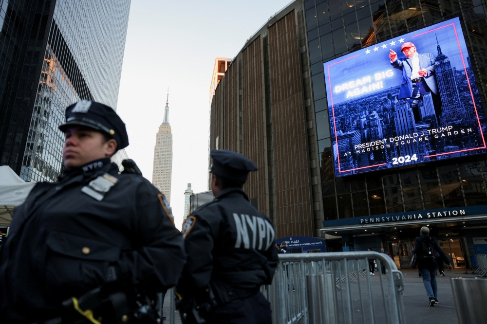 Police officers stand outside Madison Square Garden on the day of a rally for Republican presidential nominee and former U.S. President Donald Trump, in New York. — Reuters 