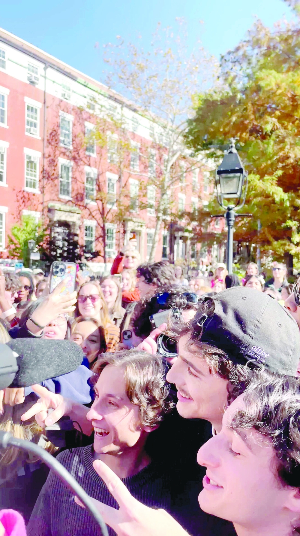 Actor Timothee Chalamet (in black hat) poses with contestants in a lookalike contest after surprising fans by turning up at the event in New York, U.S., October 27, 2024 in this still image obtained from social media video. 