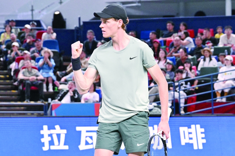Jannik Sinner reacts after a point against Djokovic. — AFP