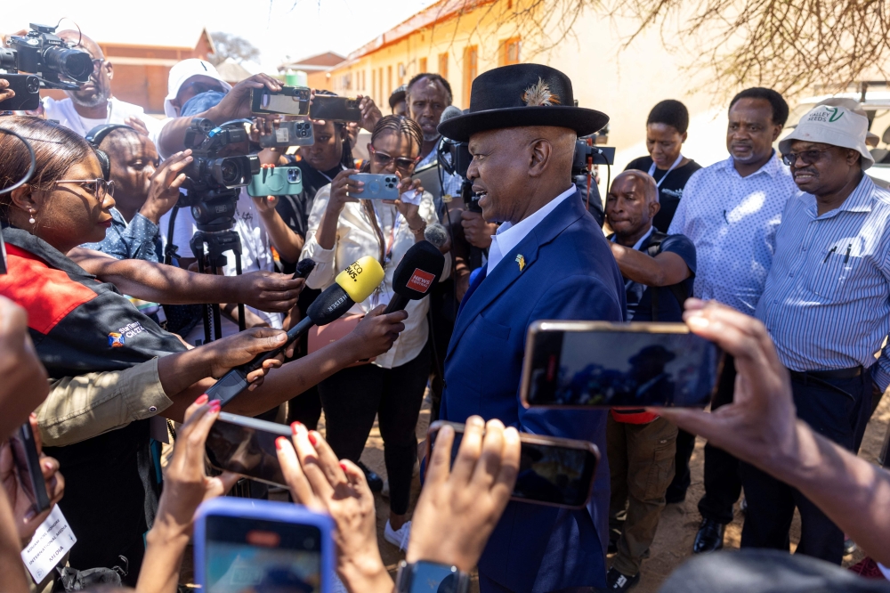 Botswana President Mokgweetsi Masisi (C) conducts a press conference, west of Gaborone. — AFP 