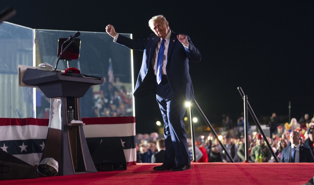 Former President Donald Trump dances during campaign rally where he spent more than 10 minutes discussing the deceased golfing champion Arnold Palmer, including crudely flattering remarks about his genitalia, at a regional airport named for the golfer in Latrobe, Pa., Oct. 19, 2024. (Doug Mills/The New York Times)