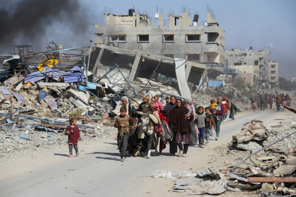 Displaced Palestinians make their way after fleeing the northern part of Gaza. — Reuters 