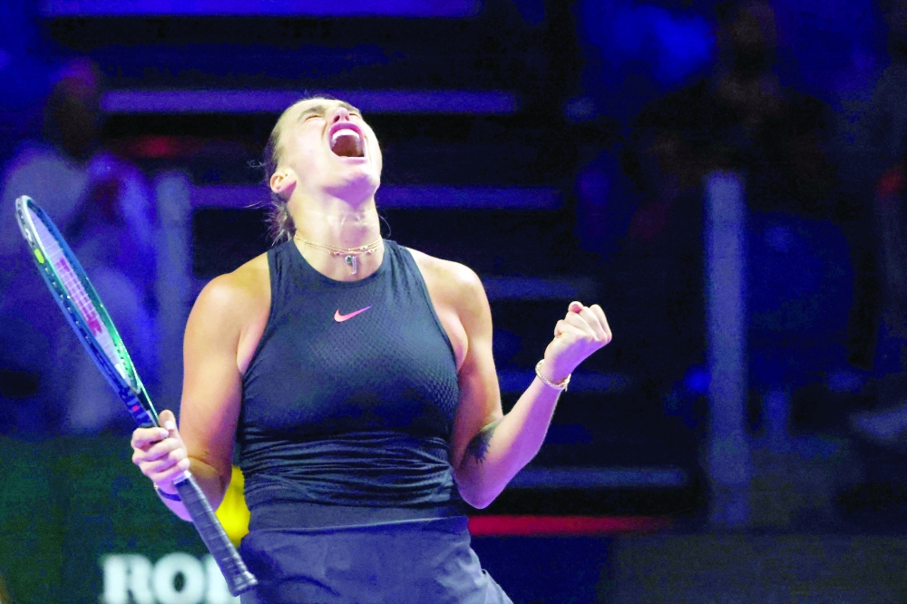 Belarus' Aryna Sabalenka reacts after winning against Italy's Jasmine Paolini during their women's singles tennis match at the WTA Finals Championship in Riyadh on November 4, 2024. 