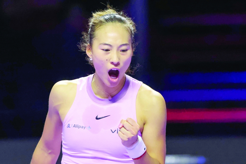 China's Qinwen Zheng reacts after a point against Kazakhstan's Elena Rybakina during their women's singles tennis match at the WTA Finals Championship in Riyadh on November 4, 2024.