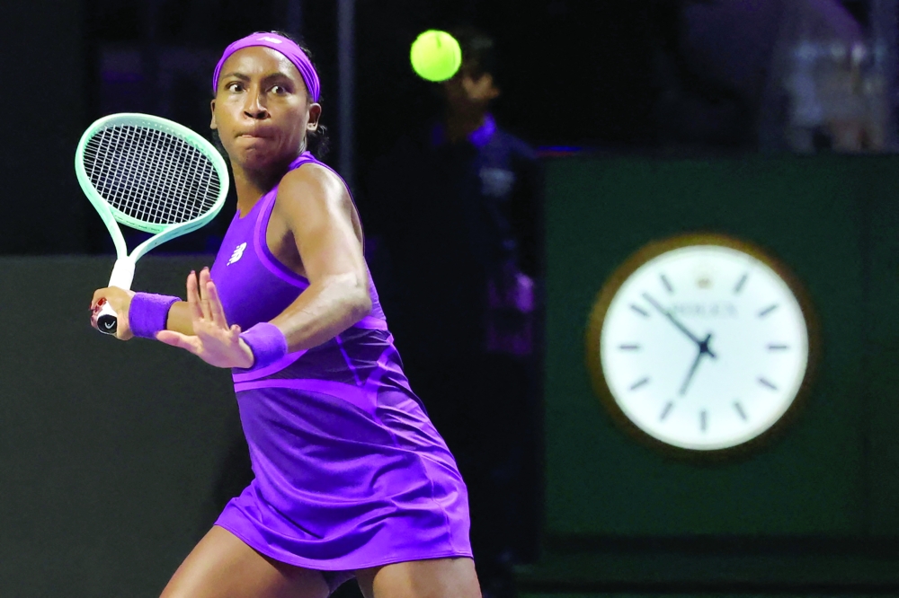 US' Coco Gauff returns the ball to Poland's Iga Swiatek during their women's singles tennis match at the WTA Finals Championship in Riyadh on November 5, 2024.
