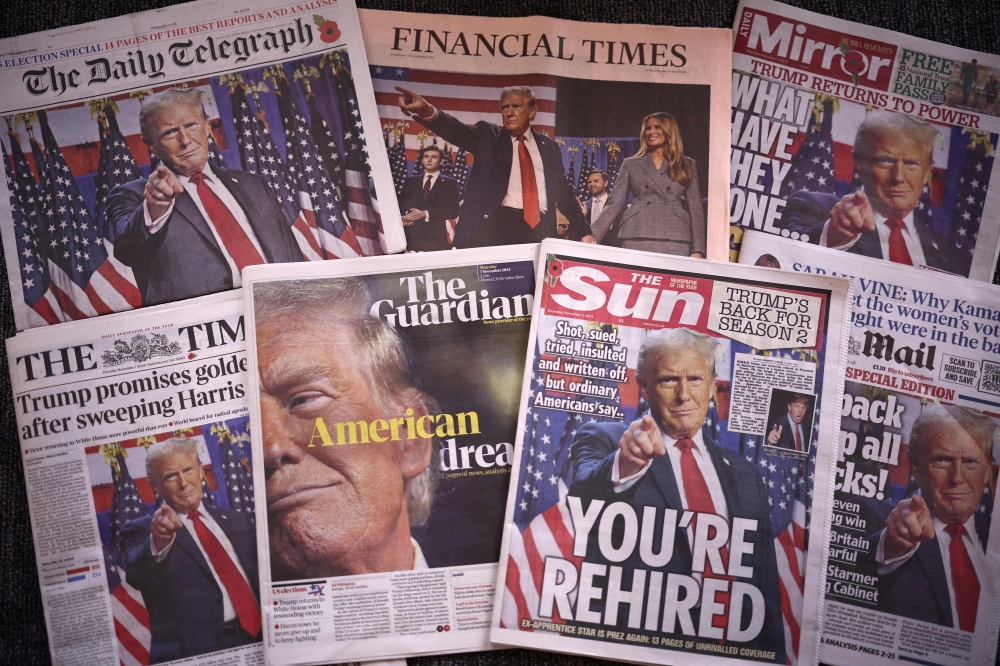 A picture taken in London shows the frontpages of some of Britain's national newspapers about the re-election of US President-elect Donald Trump. - AFP

