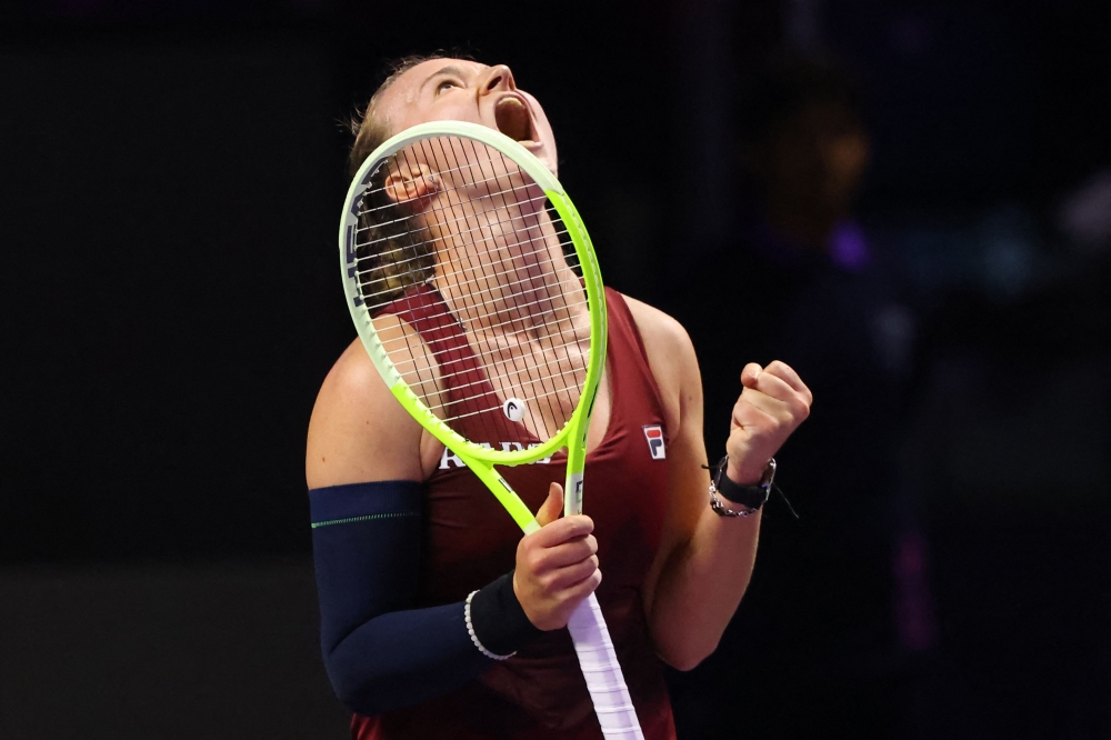 TOPSHOT - Czech Republic's Barbora Krejcikova celebrates after winning against US' Coco Gauff during their women's singles tennis match at the WTA Finals Championship in Riyadh on November 7, 2024. (Photo by Fayez NURELDINE / AFP)

