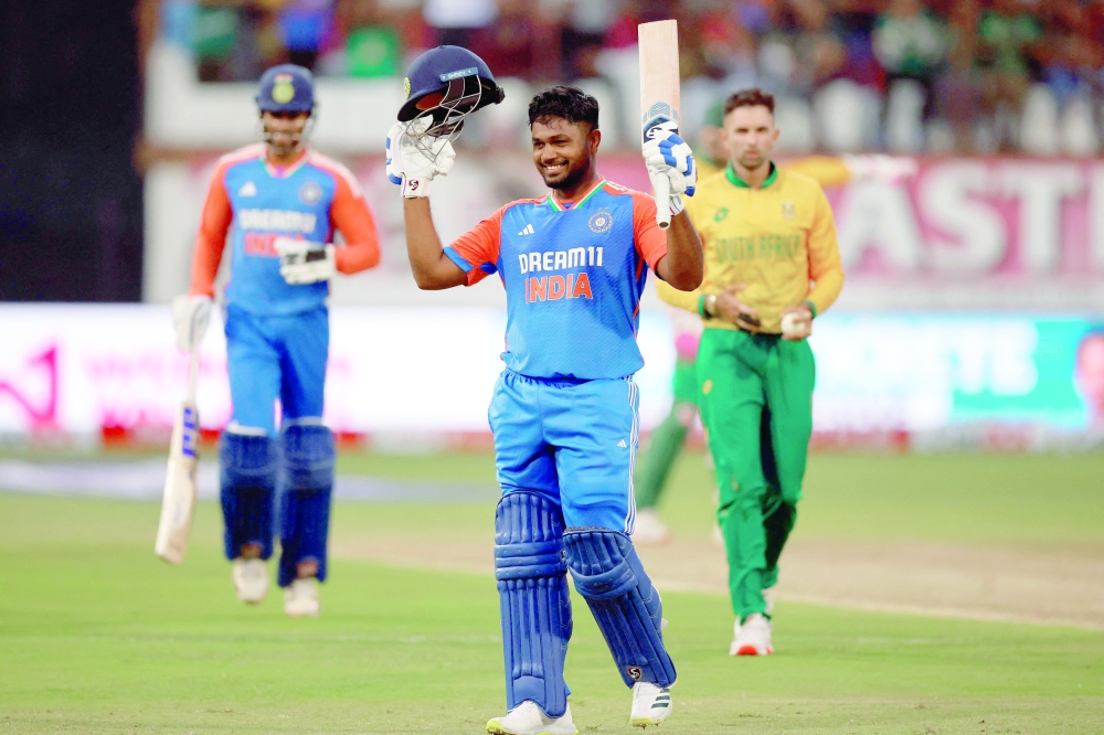 India's Sanju Samson celebrates after reaching his century. — AFP