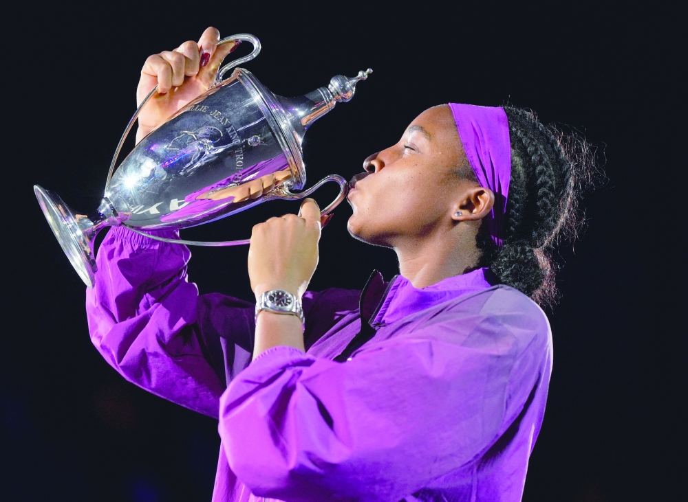 Coco Gauff of the US celebrates with the trophy. — Reuters