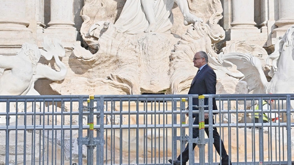 Mayor of Rome Roberto Gualtieri walks on the temporary suspended walkway inaugurated today at Trevi Fountain allowing visitors to see the fountain closer during renovation works, in Rome, on November 9, 2024.

 The work -- including cleaning stones in the lower part of the monument and grouting joints -- should be completed by the end of the year, the council said. Limited groups of visitors will be allowed to cross the fountain on a raised walkway while the maintenance is carried out. (Photo by Andreas SOLARO / AFP)

