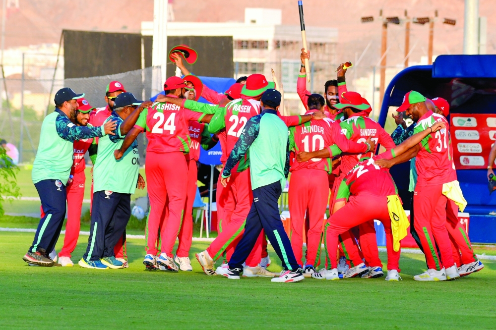 Oman players celebrate after their win against the Netherlands.