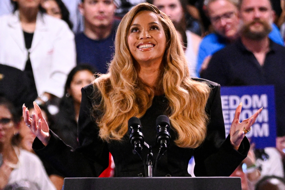(FILES) US singer-songwriter Beyonce speaks during a campaign rally for US Vice President and Democratic presidential candidate Kamala Harris at Shell Energy Stadium in Houston, Texas, on October 25, 2024. Beyonce leads the nominations for the next Grammy awards with 11, following the release of her critically acclaimed genre-bending record that vaunts Black country culture, organizers announced on November 8, 2024. - ALTERNATE CROP
 (Photo by Miguel J. Rodriguez Carrillo / AFP) / ALTERNATE CROP

