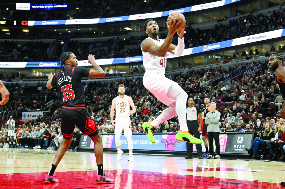 Nov 11, 2024; Chicago, Illinois, USA;  Cleveland Cavaliers guard Donovan Mitchell (45) attempts a shot against the Chicago Bulls during the first half at United Center. 