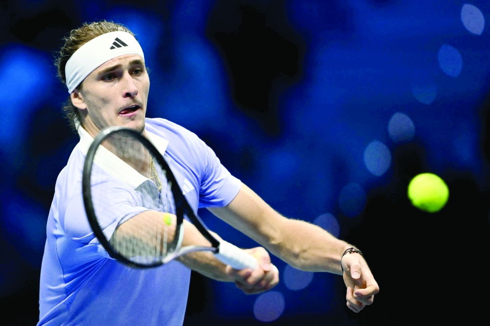 Germany's Alexander Zverev hits a return to Russia's Andrey Rublev during their match at the ATP Finals tennis tournament in Turin on November 11, 2024. 