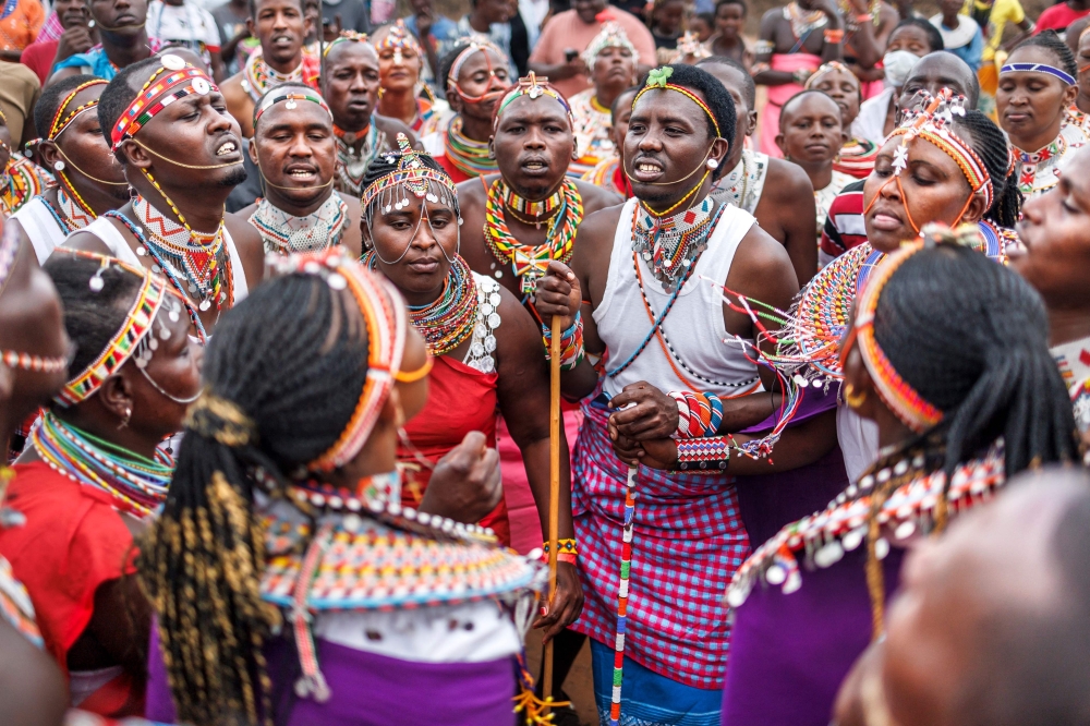 Traditionally attired members of the Samburu community perform a cultural dance at the Maa festival that brought members of Maasai tribes from across Kenya to the Samburu national reserve in Archer's Post, near Samburu, on November 7, 2024. The Maa Festival celebrates one of the best-known parts of Kenya's culture, which has been remarkably resilient even as it is strained by modernisation and climate change. (Photo by Tony KARUMBA / AFP)

