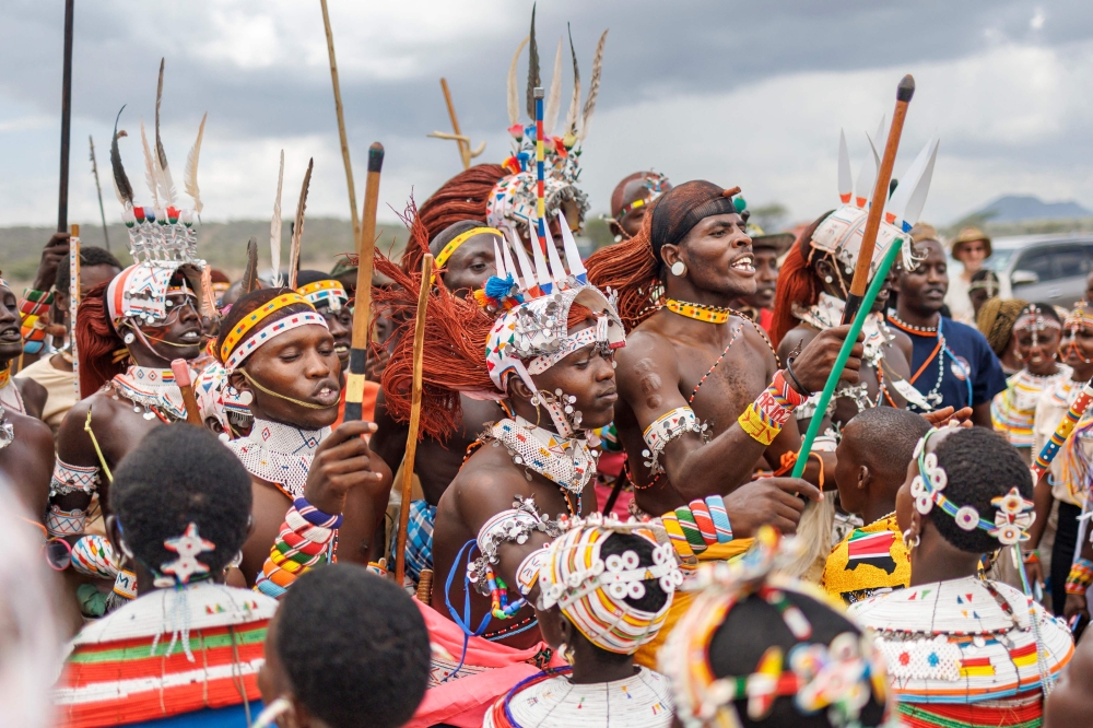 Morans (traditional warriors) of the Samburu community perform a cultural dance that entails high vertical leaps during the Maa festival that brought members of Maasai tribes from across Kenya to the Samburu national reserve in Archer's Post, near Samburu, on November 7, 2024. The Maa Festival celebrates one of the best-known parts of Kenya's culture, which has been remarkably resilient even as it is strained by modernisation and climate change. (Photo by Tony KARUMBA / AFP)

