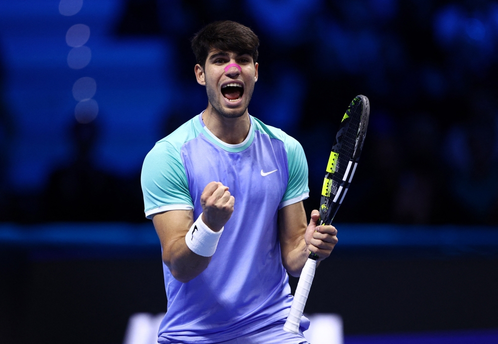 Tennis - ATP Finals - Inalpi Arena, Turin, Italy - November 13, 2024 Spain's Carlos Alcaraz celebrates after winning his singles group stage match against Russia's Andrey Rublev REUTERS/Guglielmo Mangiapane
