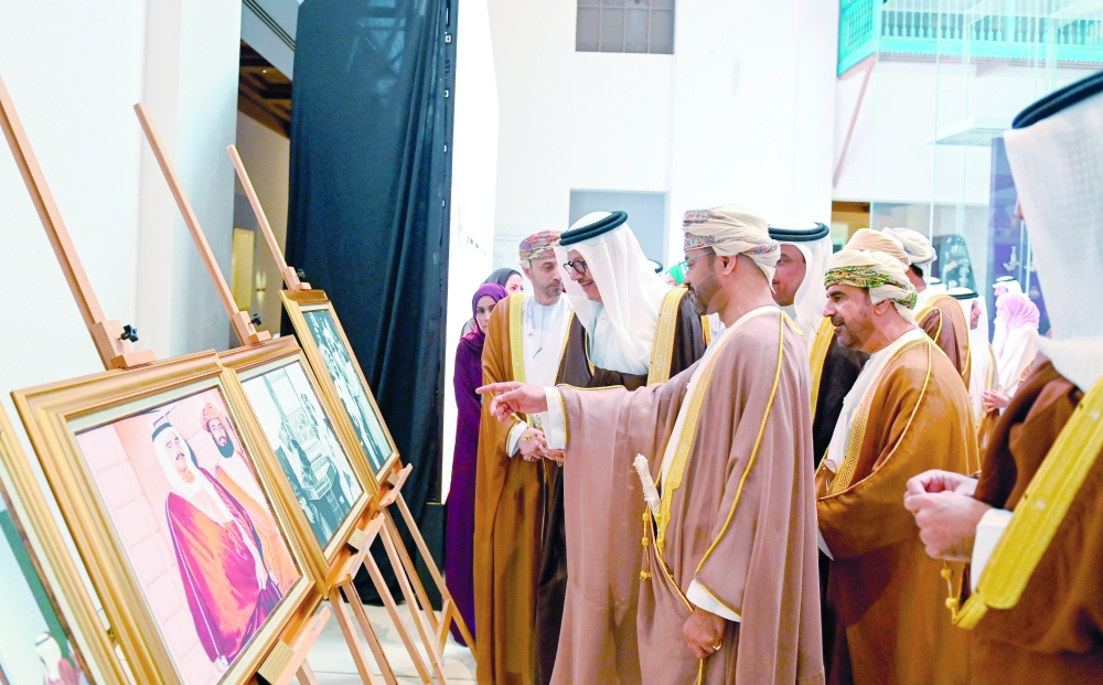Sayyid Badr bin Hamad al Busaidi and Dr Abdullatif bin Rashid al Zayani viewing the photos at the expo.