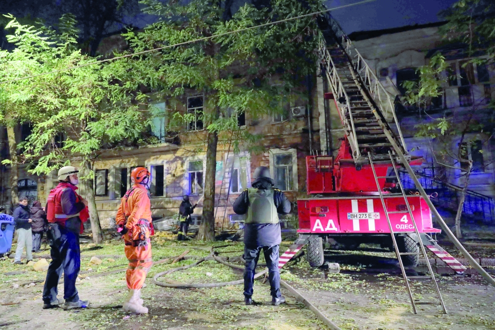 Rescuers work at the site of a Russian strike in Odesa, Ukraine. — AFP