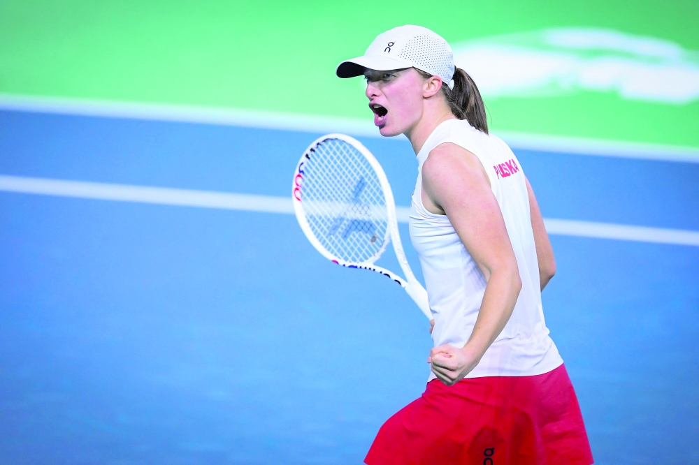 Poland's Iga Swiatek celebrates after the winning. — AFP