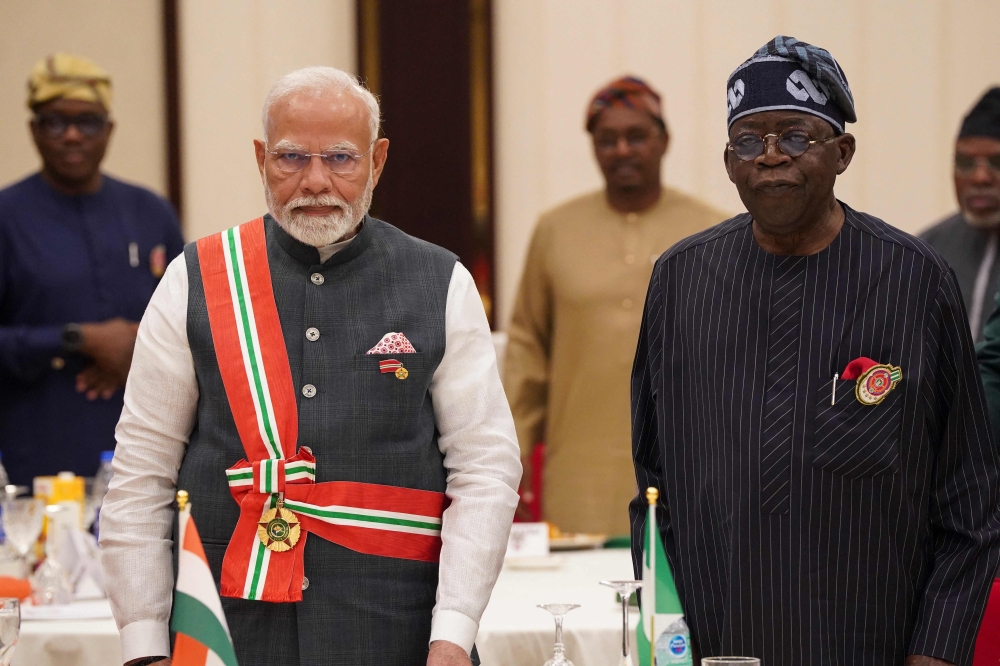 India's PM Narendra Modi (L) and Nigeria's President Bola Tinubu, pose for a photograph at the Presidential Palace in Abuja. — AFP 