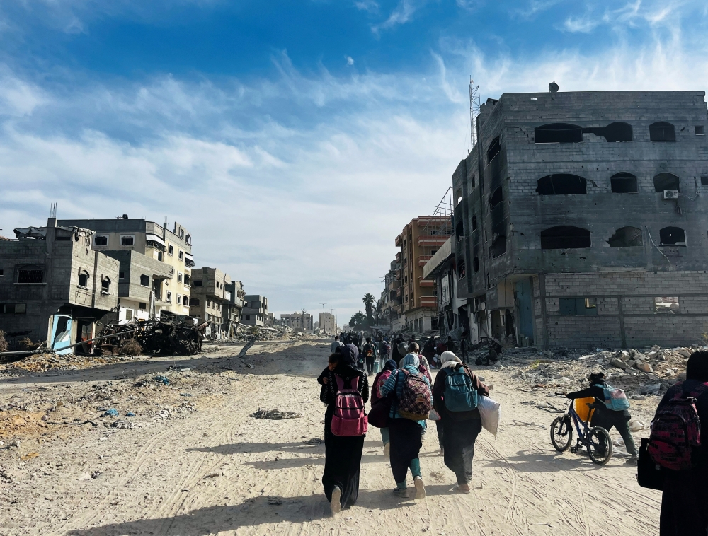 Palestinians flee during an Israeli military operation, in Beit Lahiya in the northern Gaza Strip. — Reuters 