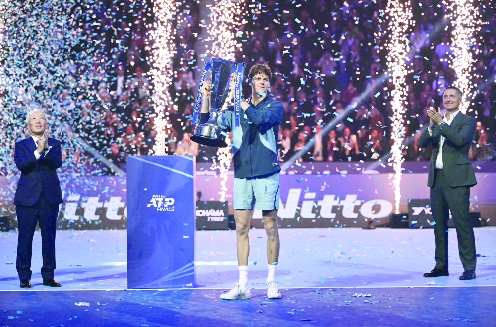 Italy's Jannik Sinner lifts the trophy. — AFP