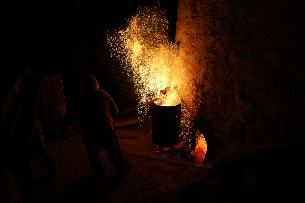 Nikos Kouvdis, 70, works in his pottery workshop using traditional methods in Agios Stefanos village, near Mandamados on the Greek island of Lesbos, Greece, July 21, 2024. His family’s dedication to preserving the craft was recently honored with inclusion in UNESCO’s National Inventory of Intangible Cultural Heritage. REUTERS/Elias Marcou
