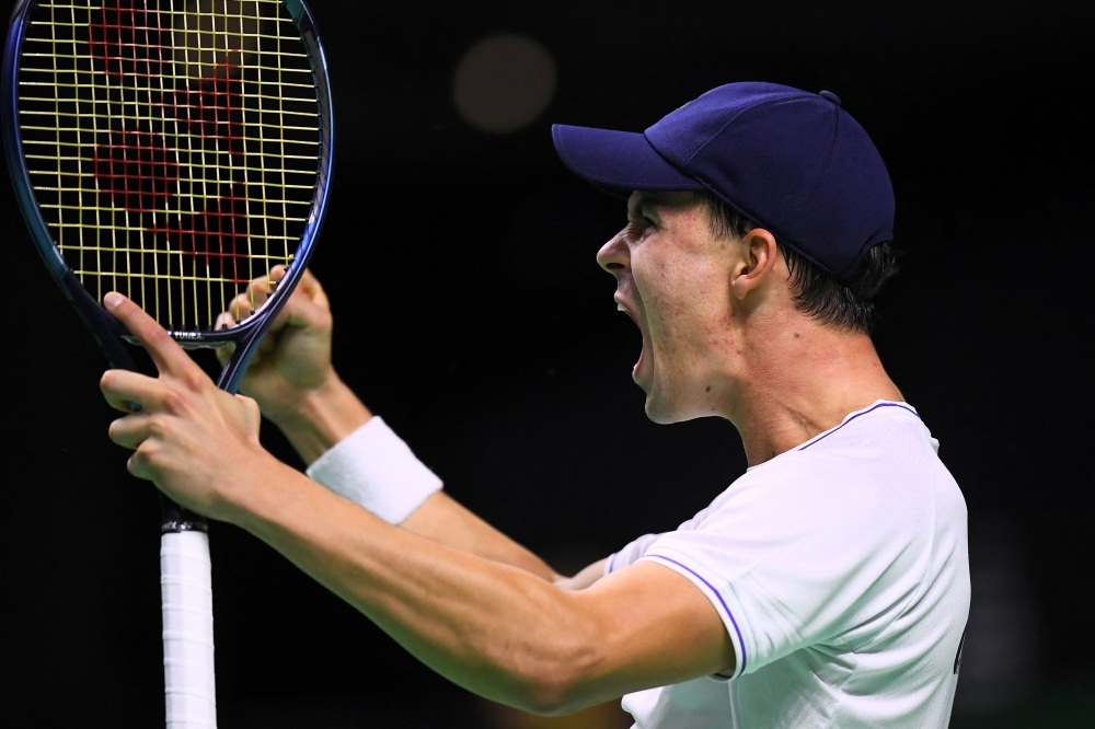 Germany's Daniel Altmaier celebrates victory against Canada's Gabriel Diallo in the quarter-final singles match between Germany and Canada during the Davis Cup Finals at the Palacio de Deportes Jose Maria Martin Carpena arena in Malaga, southern Spain, on November 20, 2024. (Photo by Jorge GUERRERO / AFP)

