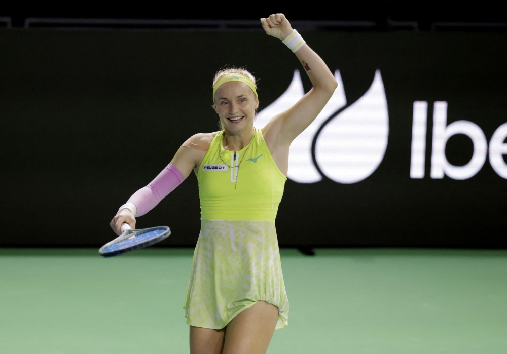 Tennis - Billie Jean King Cup Finals - Semi Final - Britain v Slovakia - Palacio de Deportes Jose Maria Martin Carpena Arena, Malaga, Spain - November 19, 2024 Slovakia's Rebecca Sramkova celebrates after winning her match against Britain's Katie Boulter REUTERS/Jon Nazca
