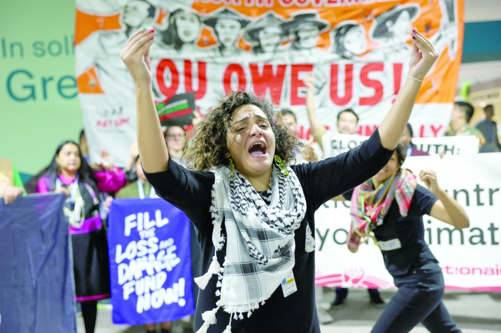 Activists hold a protest calling on developed nations to provide financing to fight climate change, during the COP29 United Nations Climate Change Conference, in Baku, Azerbaijan. — Reuters