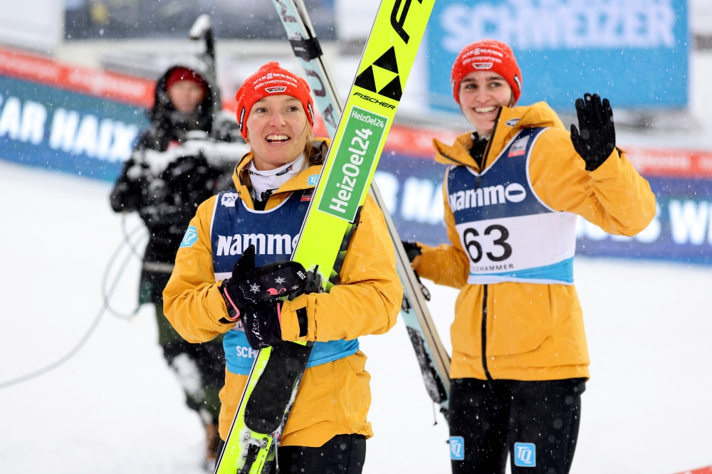 Germany's Katharina Schmid celebrates after winning the Women's Large Hill HS140 with second place Germany's Selina Freitag  Geir Olsen. — REUTERS