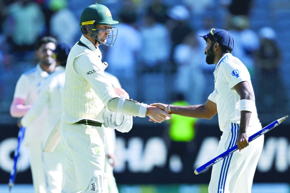 Australia's Josh Hazlewood shakes hands with India's Jasprit Bumrah after the match Dean Lewins — REUTERS