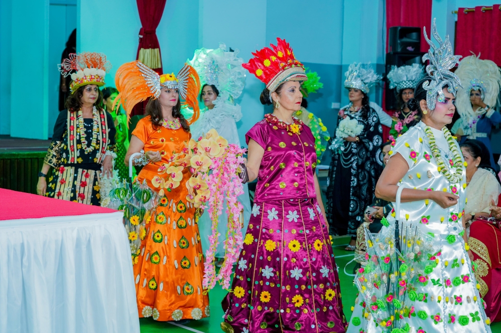 Ladies walk the ramp for the ISC's flower fashion show
