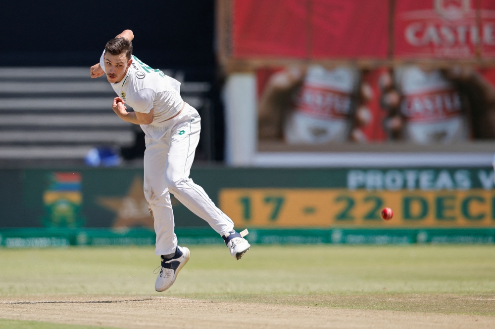 TOPSHOT - South Africa's Marco Jansen delivers a ball during the second day of the first Test cricket match between South Africa and Sri Lanka at the Kingsmead stadium in Durban on November 28, 2024. (Photo by PHILL MAGAKOE / AFP)

