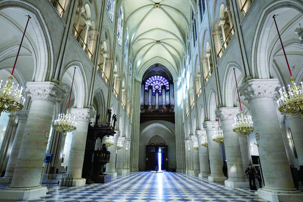 The nave, the western Rose window and the organ of Notre-Dame de Paris cathedral in Paris. — AFP