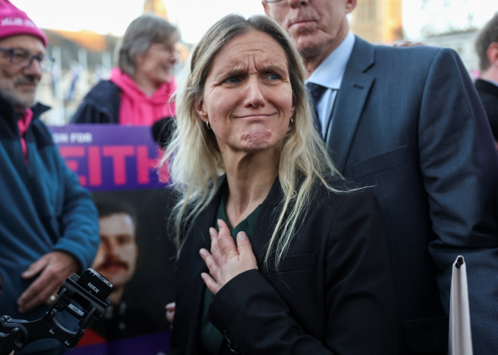Kim Leadbeater, MP for Spen Valley, reacts during a demonstration in support of assisted dying outside the British parliament 