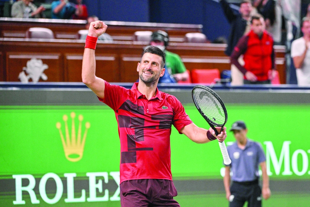 Djokovic celebrates after winning against Michelsen. — AFP